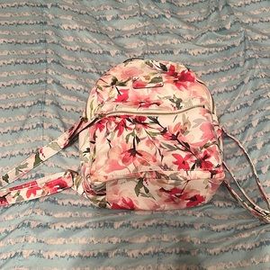 A white, pink and green floral mini backpack from Liz claiborne